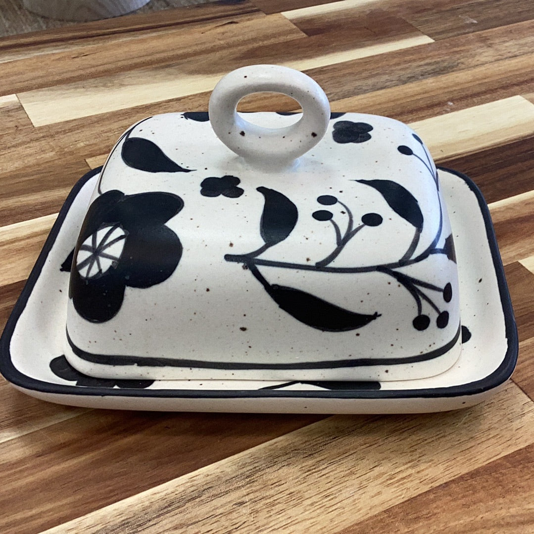 Hand painted butter dish with floral design…black and cream