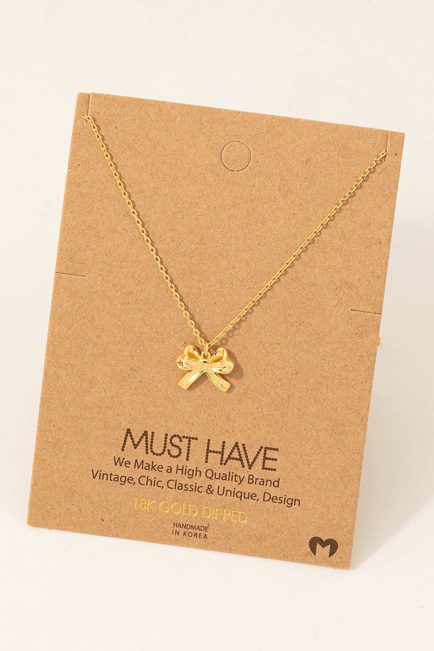 Gold Dipped Ribbon Bow Necklace: Gold