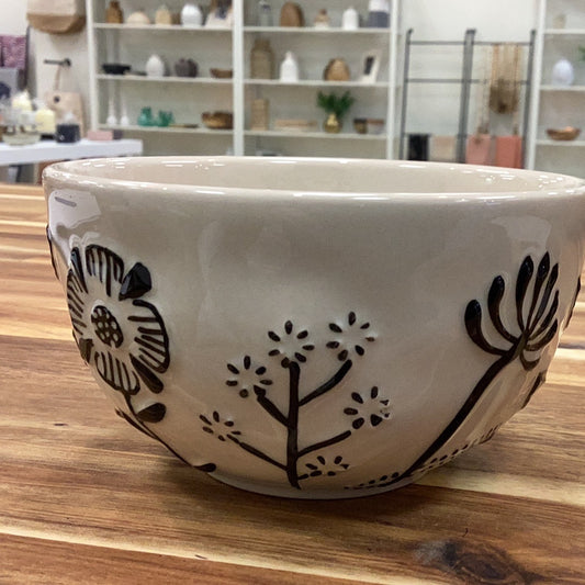Hand painted bowl with embossed black flowers