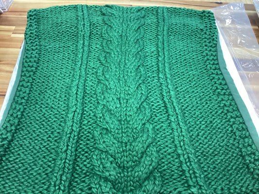 Green cable knit pillow