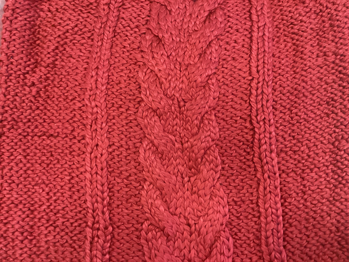 Red cable knit pillow