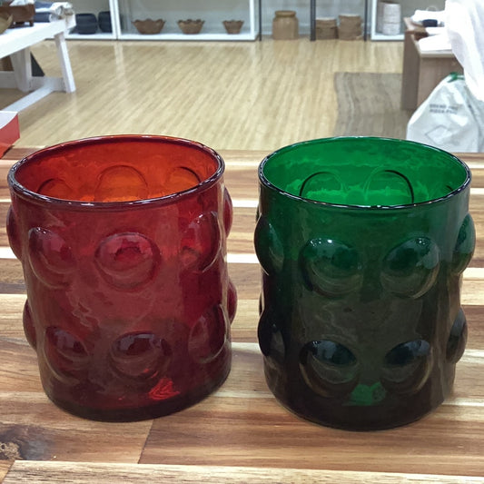 Drinking glass/votive holder with raised dots
