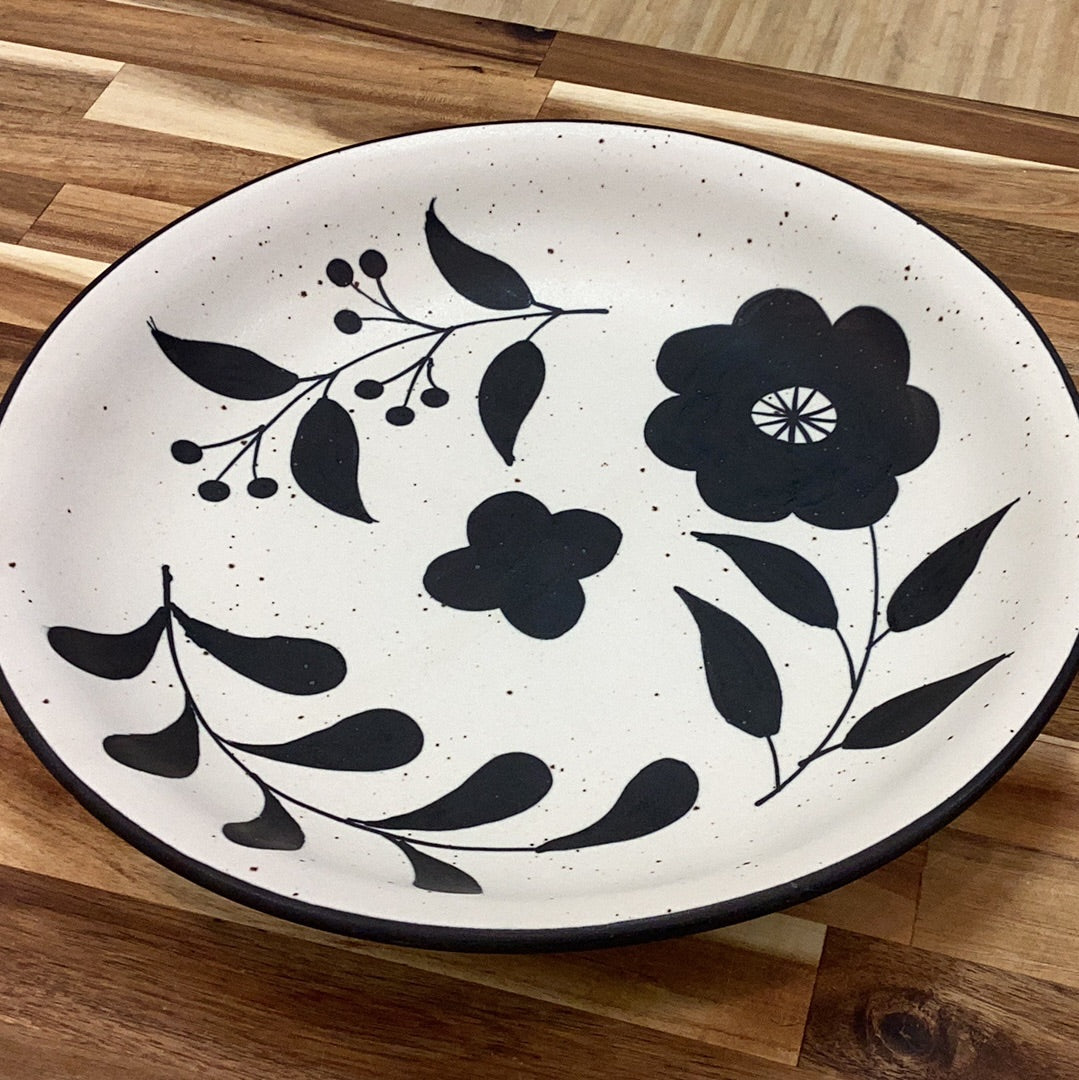 Hand painted stoneware bowl with floral design….matte black and cream color…speckled