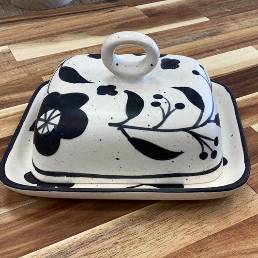Hand painted butter dish with floral design…black and cream